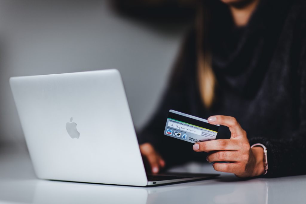 woman paying credit card debt reduce DTI