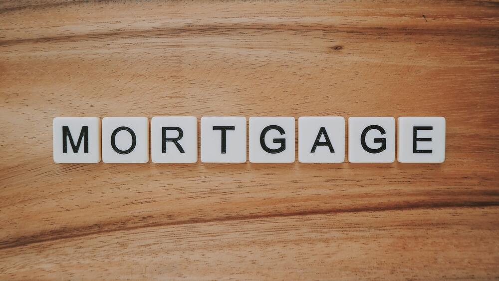 scrabble tiles spelling out mortgage for rental property