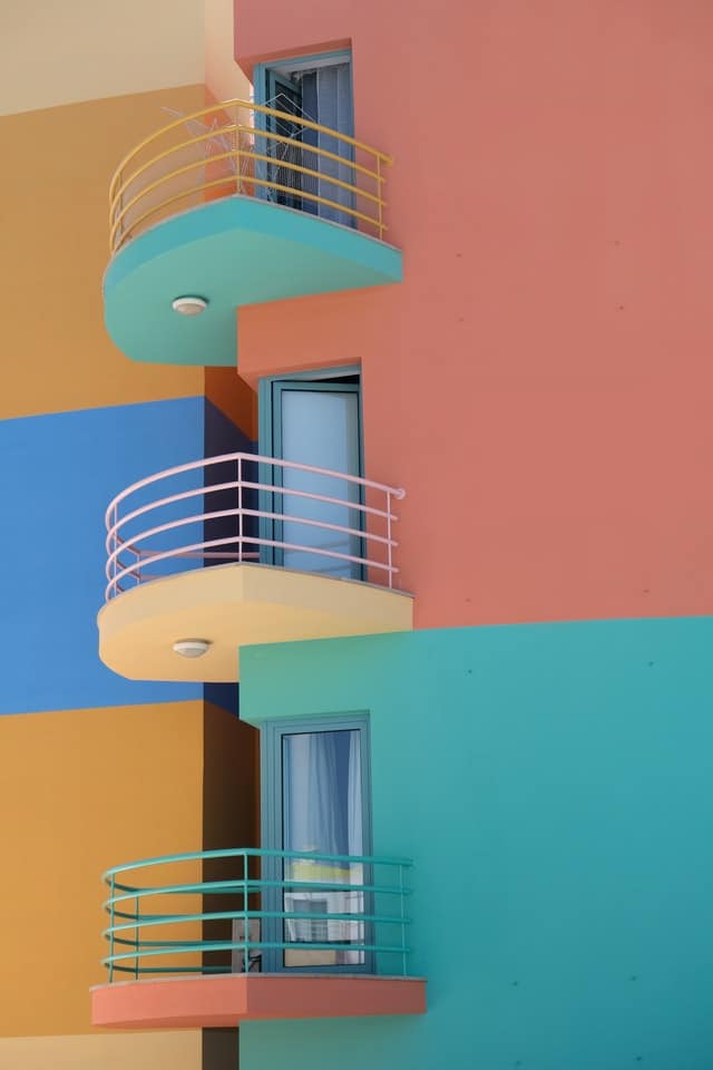 rental property with balconies and bright colors owned by buy and hold investor