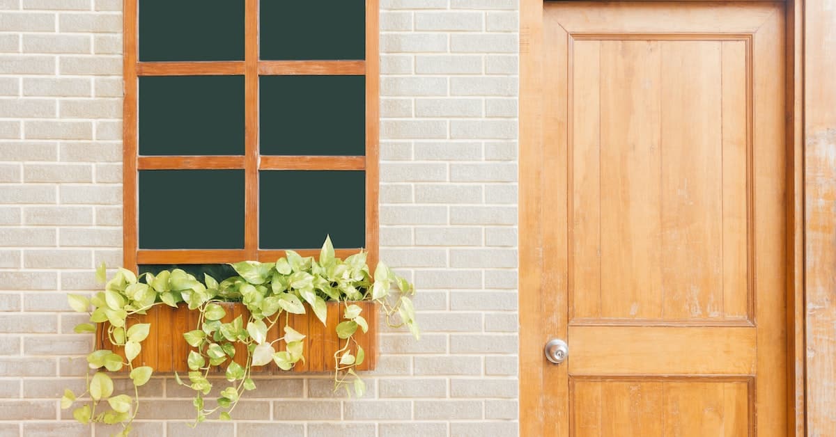 door window and flower basket of home in a trust