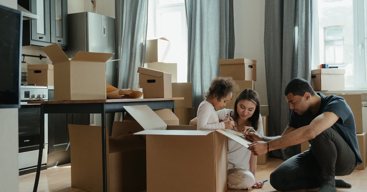 happy family moving into house rented from brrrr investor